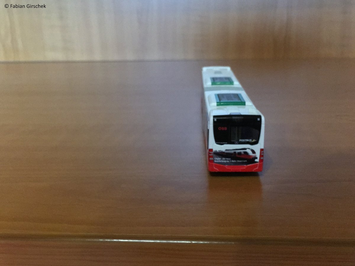 Mercedes Citaro G von ÖBB Postbus mit ÖBB cityjet Werbung im Modell H0.